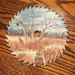 Hand painted saw blade wall decor.